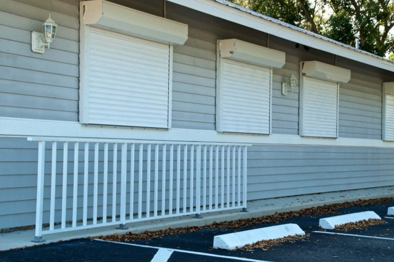 Roll-down hurricane shutters on a commercial building